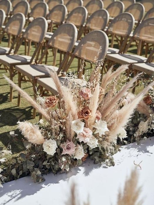 39 Charming Farmhouse Wedding Decor Ideas For Your Big Day 27 Dried Grasses Aisle in Farmhouse Chic Wedding Decor