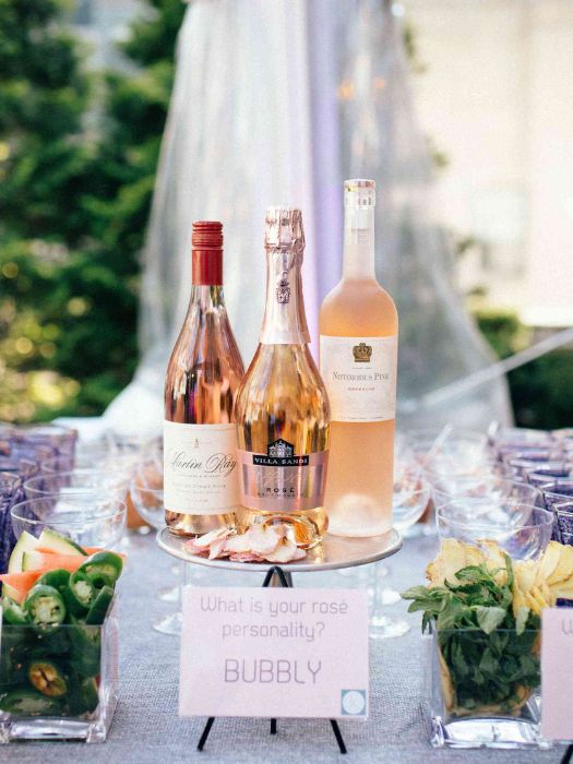35 Perfect Wedding Cocktail Table Decor You Can Afford 5 Rosé Bottle Display Wedding Cocktail Table